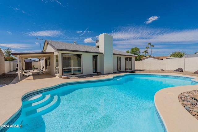 view of swimming pool featuring a patio area