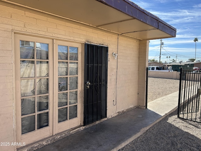 doorway to property with a gate and fence