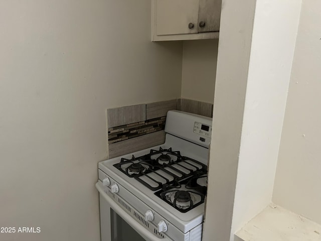 kitchen with white gas range