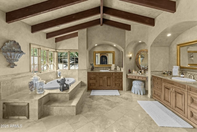 4726 E Sierra Vista Dr, Paradise Valley, AZ 85253 - full bathroom featuring vaulted ceiling with beams, two vanities, a bath, and a sink