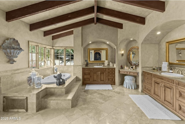 4726 E Sierra Vista Dr, Paradise Valley, AZ 85253 - bathroom featuring lofted ceiling with beams, two vanities, a sink, and a garden tub