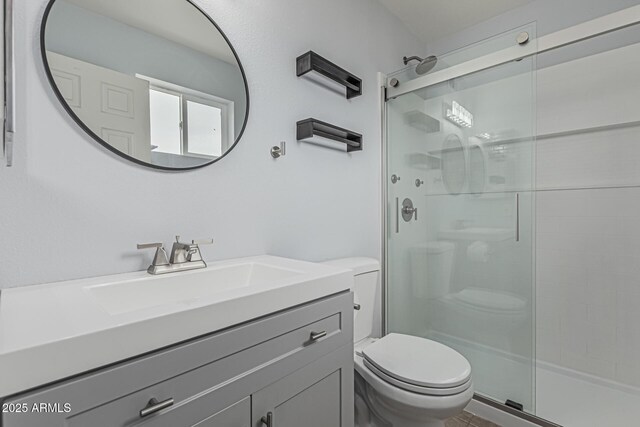 9609 N 44th Ave, Glendale, AZ 85302 - full bathroom featuring vanity, toilet, and a shower stall