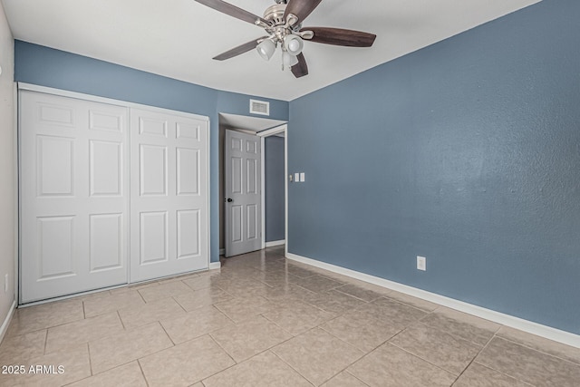 9609 N 44th Ave, Glendale, AZ 85302 - unfurnished bedroom with tile patterned floors, visible vents, baseboards, and a closet