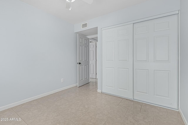 9609 N 44th Ave, Glendale, AZ 85302 - unfurnished bedroom with baseboards, visible vents, ceiling fan, and a closet