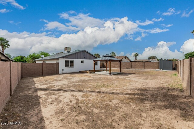 9609 N 44th Ave, Glendale, AZ 85302 - back of house featuring a gazebo, a shed, a fenced backyard, an outbuilding, and a patio area