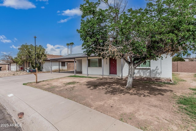 9609 N 44th Ave, Glendale, AZ 85302 - single story home with a carport, fence, and concrete driveway