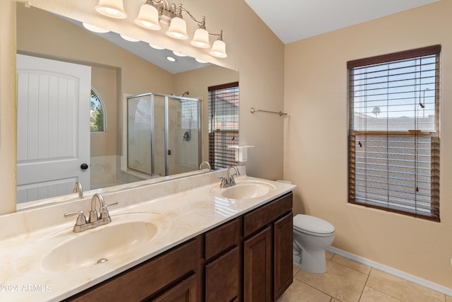 bathroom featuring dual sinks, oversized vanity, toilet, tile floors, and a shower with door