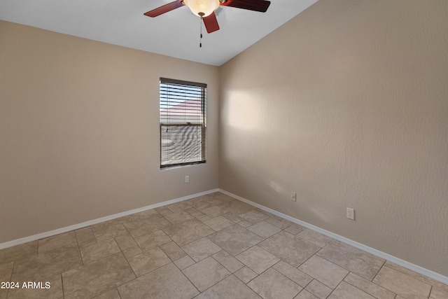 tiled spare room featuring ceiling fan and lofted ceiling