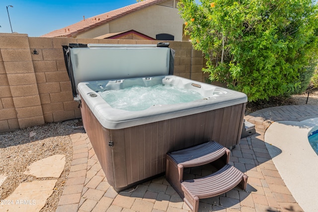 view of terrace featuring a hot tub