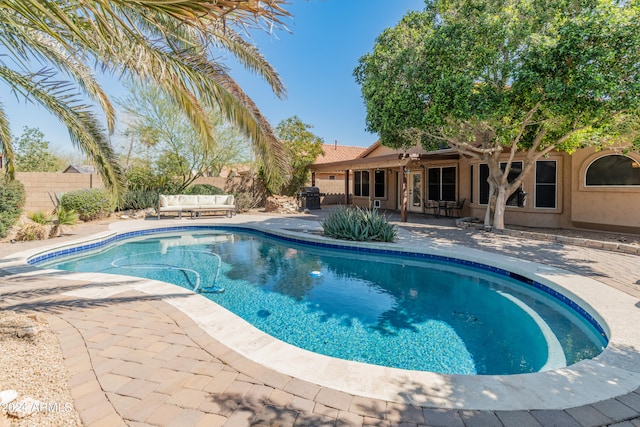 view of swimming pool featuring a patio