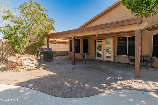 view of patio with area for grilling and french doors