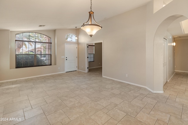 spare room with light tile floors