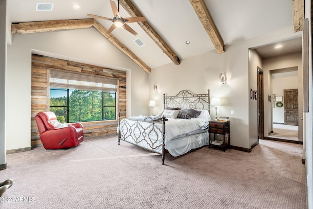 bedroom with ceiling fan, high vaulted ceiling, carpet flooring, and beam ceiling