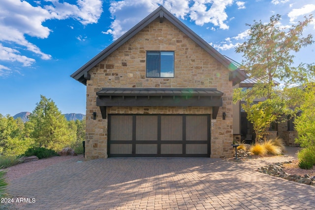 exterior space featuring a mountain view and a garage