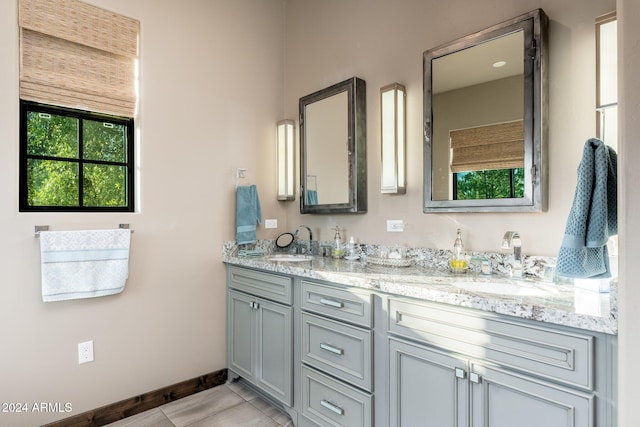 bathroom with vanity and tile patterned flooring