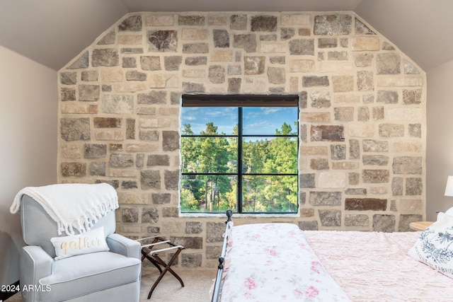 carpeted bedroom featuring lofted ceiling