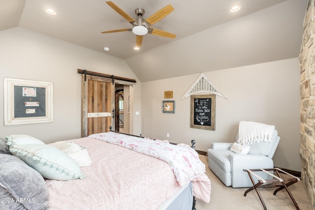 carpeted bedroom featuring ceiling fan, lofted ceiling, and a barn door
