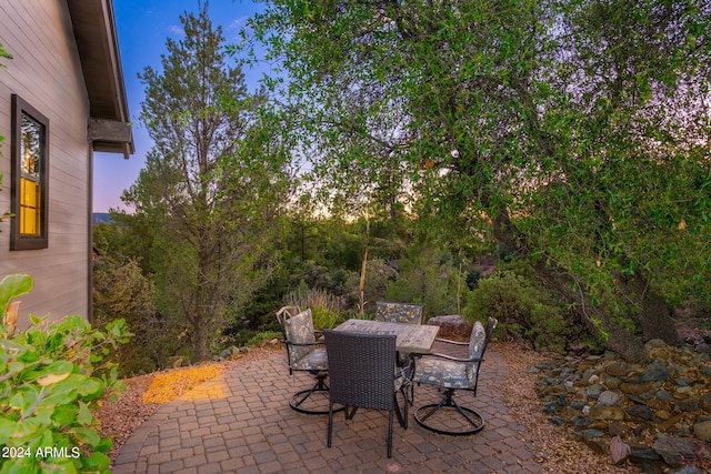 view of patio terrace at dusk