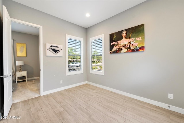 spare room with light hardwood / wood-style floors