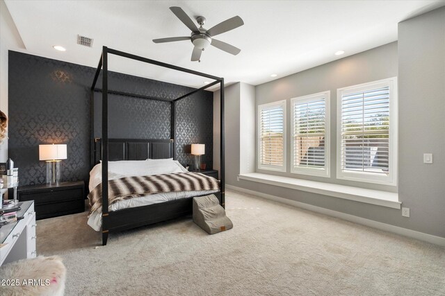 bedroom with light carpet and ceiling fan