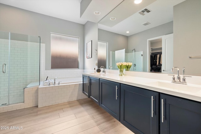 bathroom with vanity and plus walk in shower