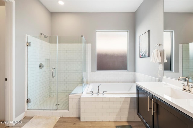 bathroom featuring vanity, tile patterned floors, and plus walk in shower