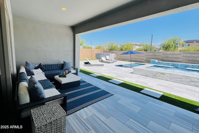 wooden terrace with outdoor lounge area, a pool with hot tub, and a patio