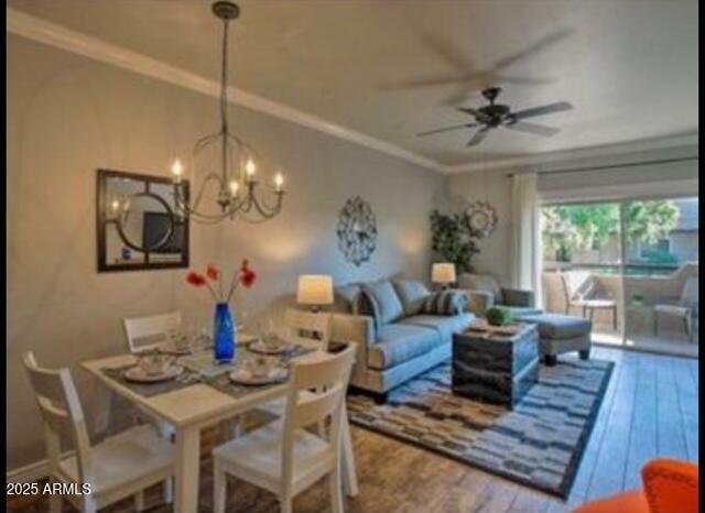9450 E Becker Ln Unit 2099, Scottsdale, AZ 85260 - dining space featuring wood-type flooring, a ceiling fan, crown molding, and a chandelier