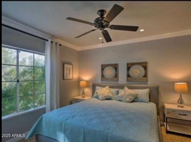 9450 E Becker Ln Unit 2099, Scottsdale, AZ 85260 - bedroom with ornamental molding and a ceiling fan