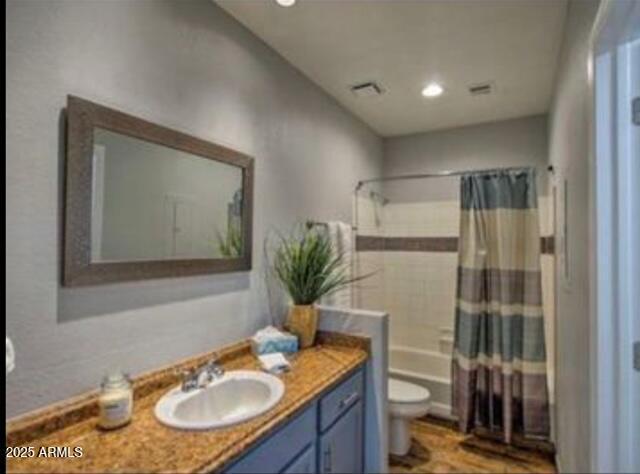 9450 E Becker Ln Unit 2099, Scottsdale, AZ 85260 - full bath with vanity, toilet, shower / bath combo, and recessed lighting