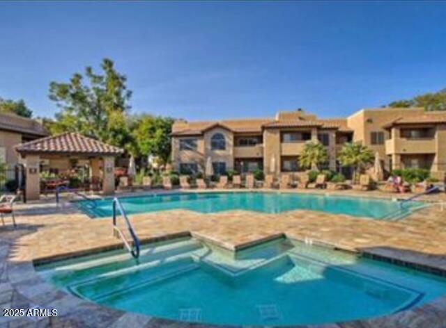 9450 E Becker Ln Unit 2099, Scottsdale, AZ 85260 - community pool featuring a hot tub and a gazebo