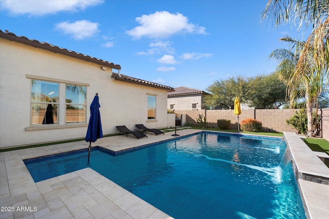 view of pool featuring pool water feature and a patio area