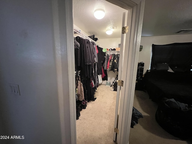 walk in closet with carpet flooring and visible vents