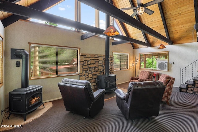 living room featuring beam ceiling, wood ceiling, a wood stove, and carpet flooring