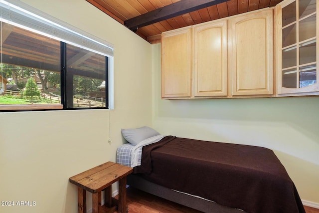 bedroom with wooden ceiling, hardwood / wood-style flooring, and beamed ceiling