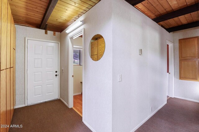 bedroom with wooden ceiling, vaulted ceiling with beams, and hardwood / wood-style floors