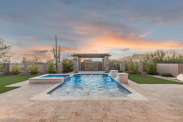 7254 E Sonoran Trl, Scottsdale, AZ 85266 - pool at dusk featuring a patio area, a fenced backyard, and a pool with connected hot tub
