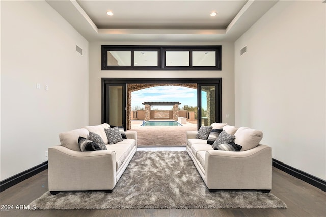 7254 E Sonoran Trl, Scottsdale, AZ 85266 - living room with wood finished floors, a high ceiling, and a raised ceiling