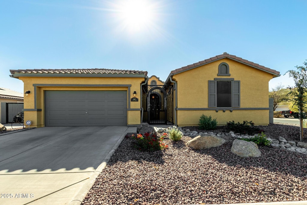 mediterranean / spanish-style house featuring a garage