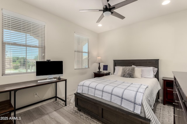 27418 W Mohawk Ln, Buckeye, AZ 85396 - bedroom featuring wood finished floors, recessed lighting, baseboards, and a ceiling fan