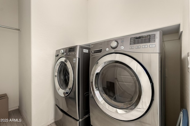 27418 W Mohawk Ln, Buckeye, AZ 85396 - laundry area with washing machine and dryer