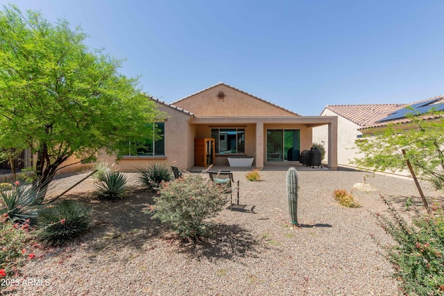 27418 W Mohawk Ln, Buckeye, AZ 85396 - back of property featuring stucco siding, a patio, and a tile roof