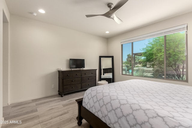 27418 W Mohawk Ln, Buckeye, AZ 85396 - bedroom with light wood-style floors, recessed lighting, ceiling fan, and baseboards