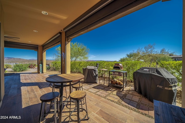 view of patio featuring a mountain view and area for grilling