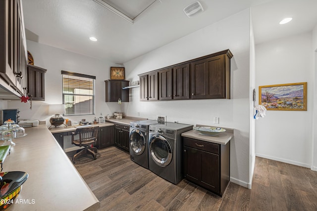 clothes washing area with cabinets, separate washer and dryer, and dark wood-type flooring