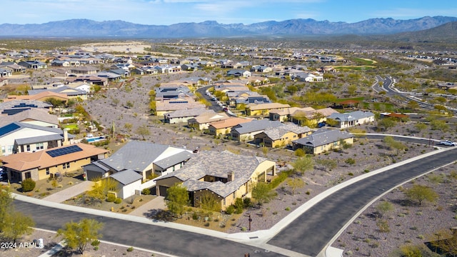 birds eye view of property featuring a mountain view