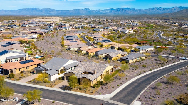 birds eye view of property featuring a mountain view