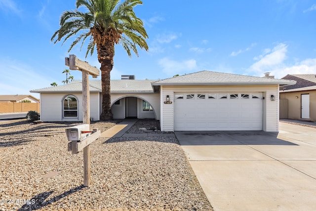 ranch-style house featuring a garage