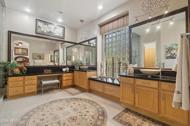 bathroom featuring tile patterned flooring, vanity, and ceiling fan