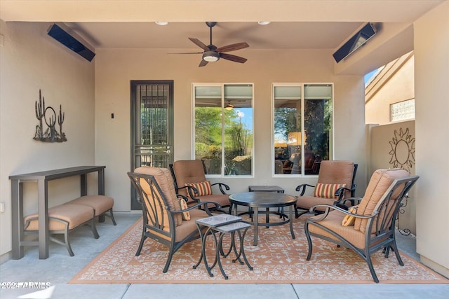 view of patio with ceiling fan and an outdoor hangout area